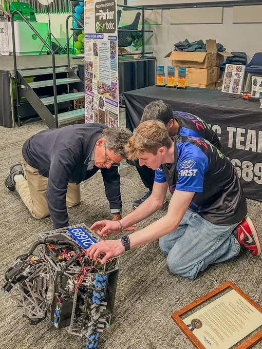 Rick Cohen examining our robot up close at competition